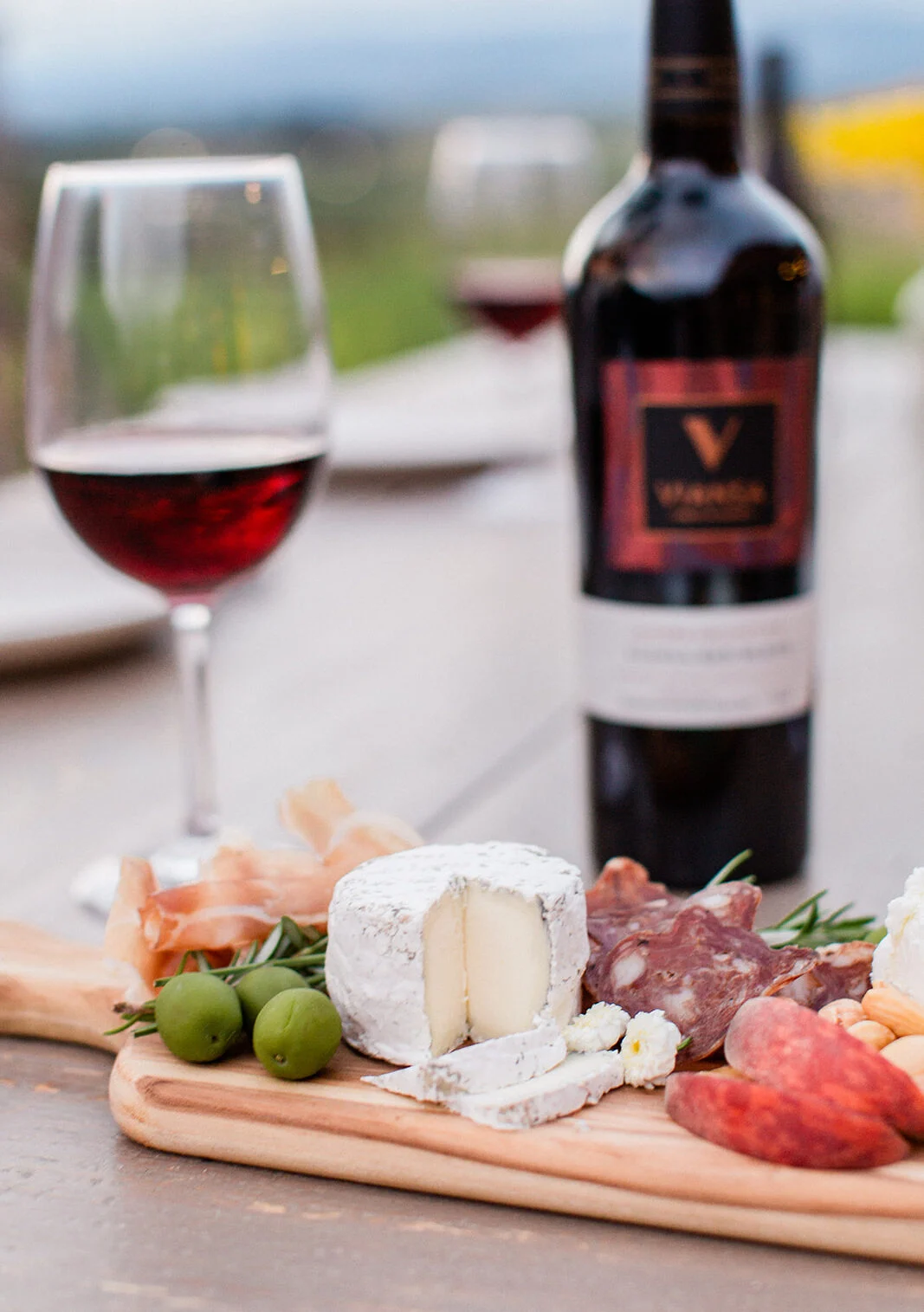 Cheese and charcuterie board with red wine
